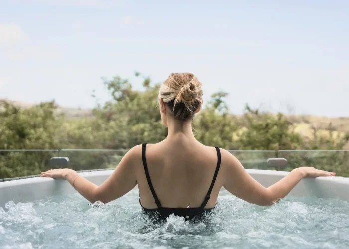 Woman in outdoor hot tub